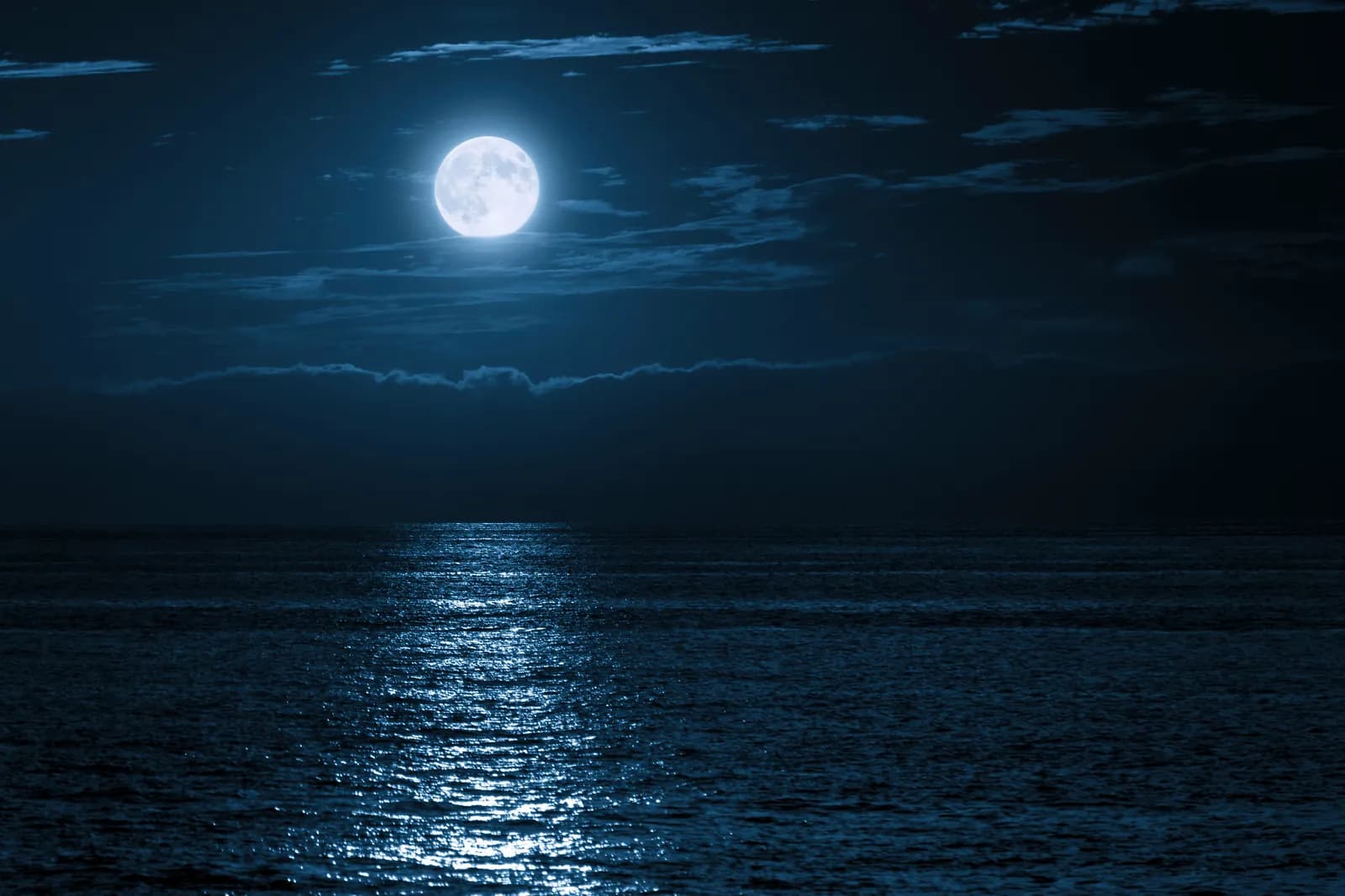 Moonlight reflecting over calm ocean waters